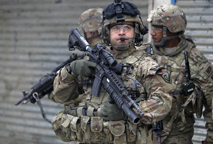 U.S. troops with the International Security Assistance Force keep watch at site of a suicide attack in Kabul