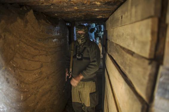 An American who calls himself "Hunter" walks inside a bunker near the town of Yasynuvata